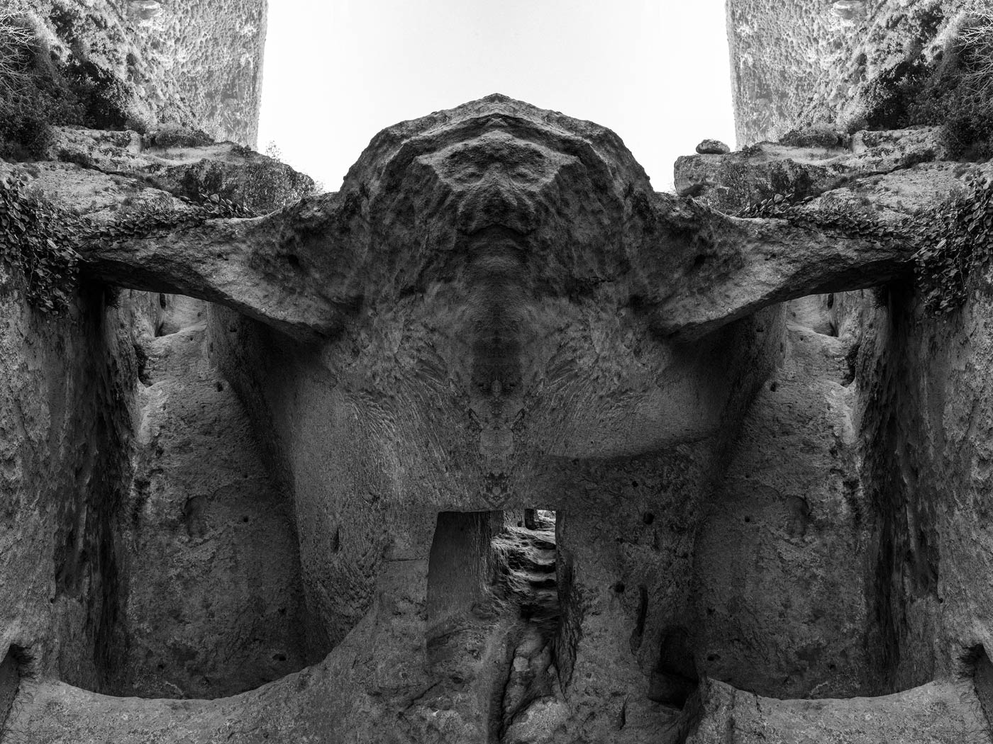 Mirrored rock-cut chamber resembling a dormant being