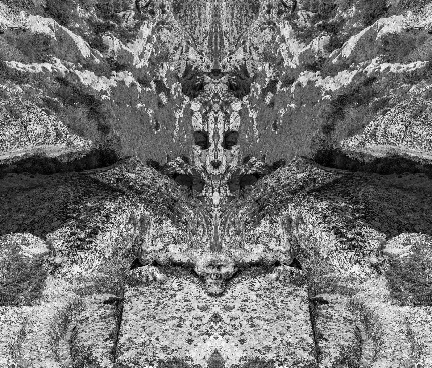 Mirrored limestone ravine forming a dreamlike figure