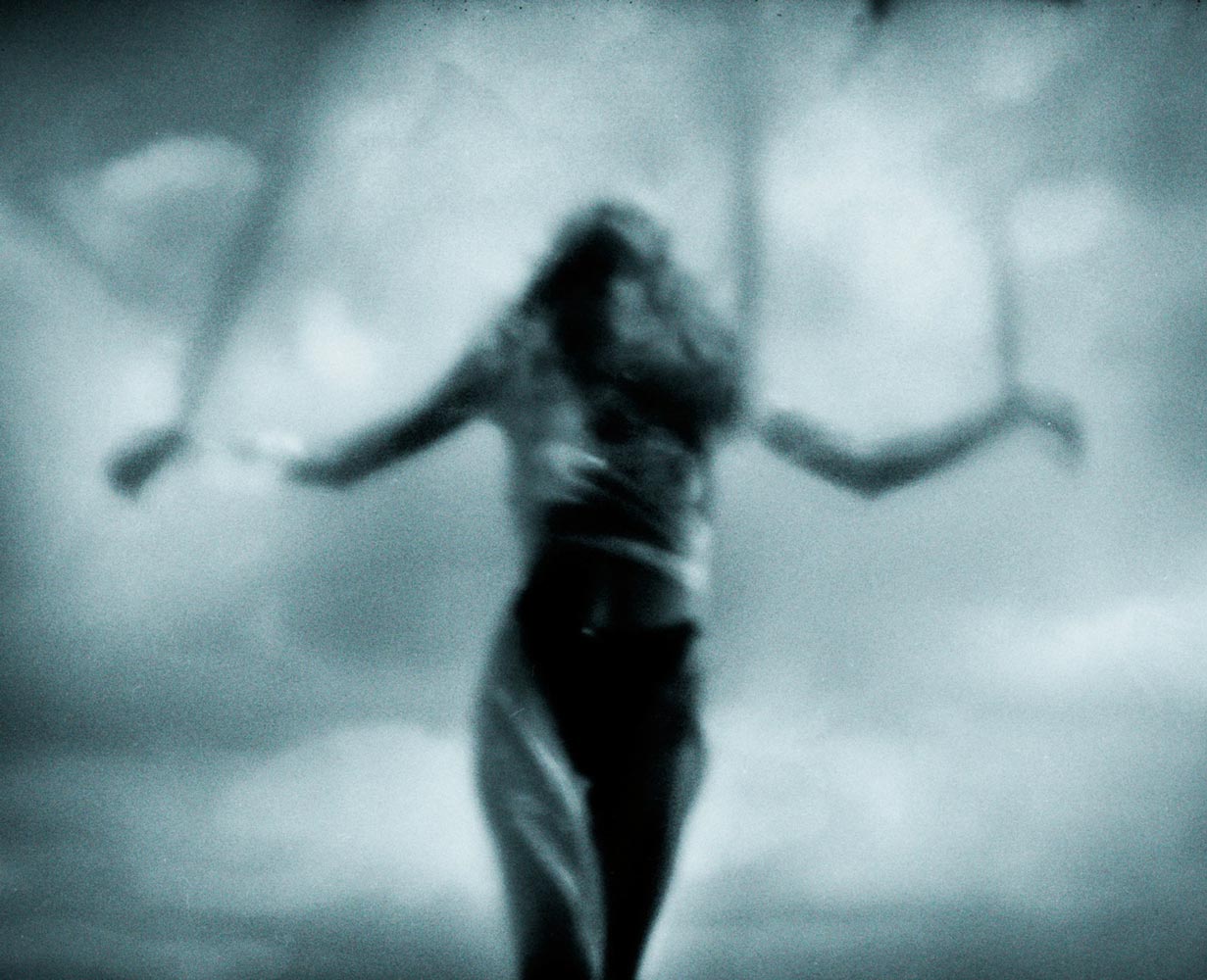 Figure wrapped in translucent material in a dreamlike scene — photograph 02