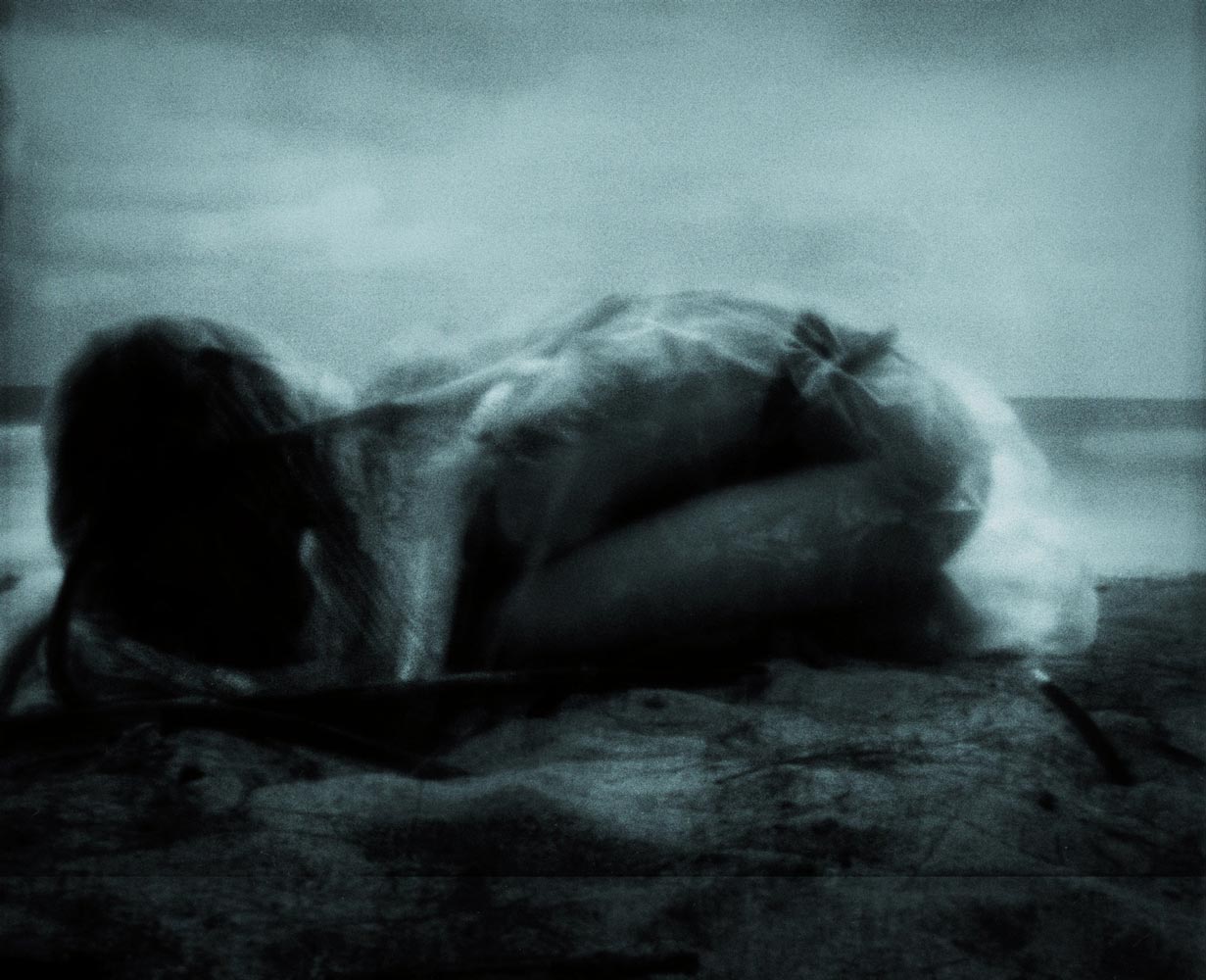 Figure wrapped in translucent material in a dreamlike scene — photograph 03