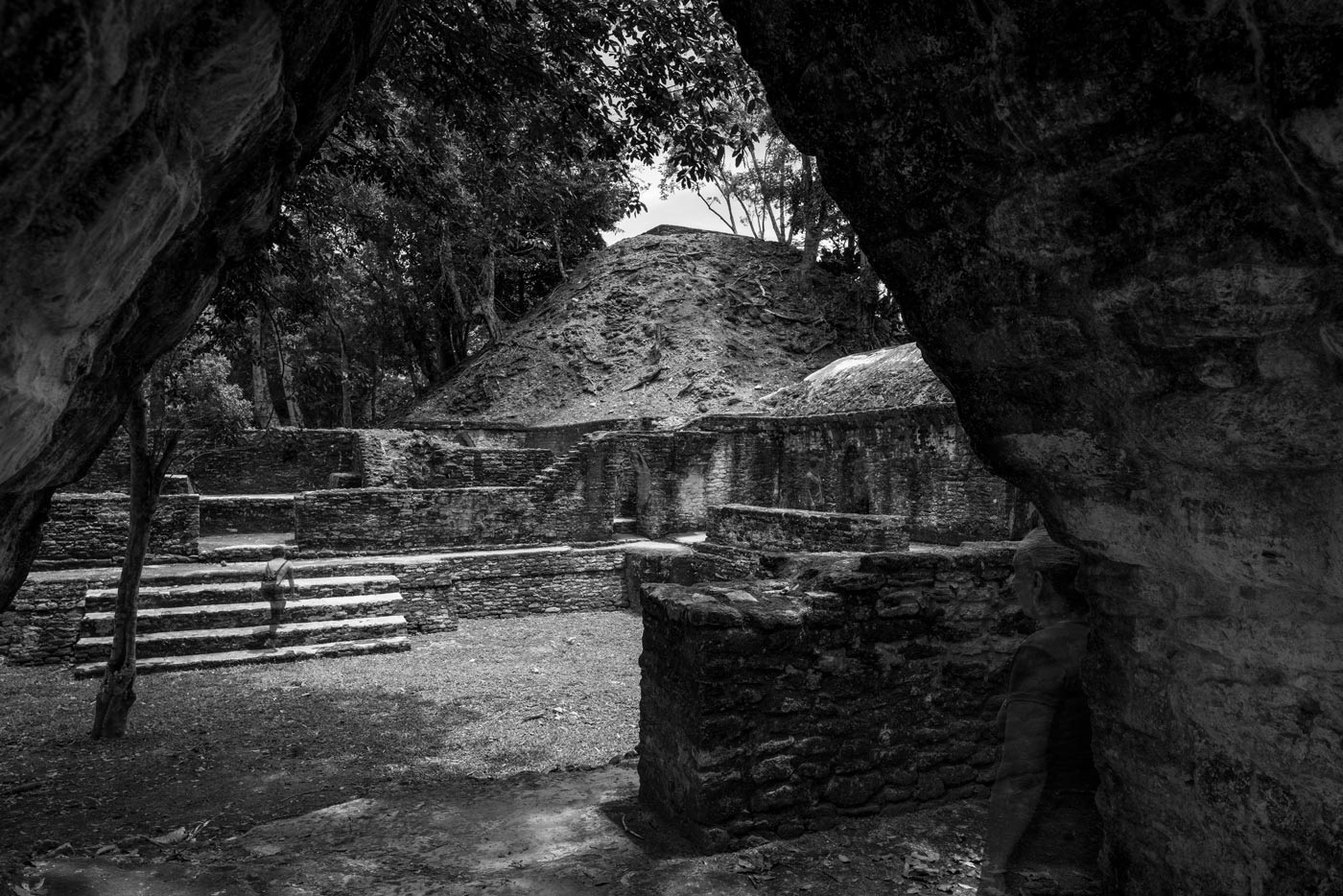 Ghostlike Maya visitors moving through the ancient city of Cahal Pech